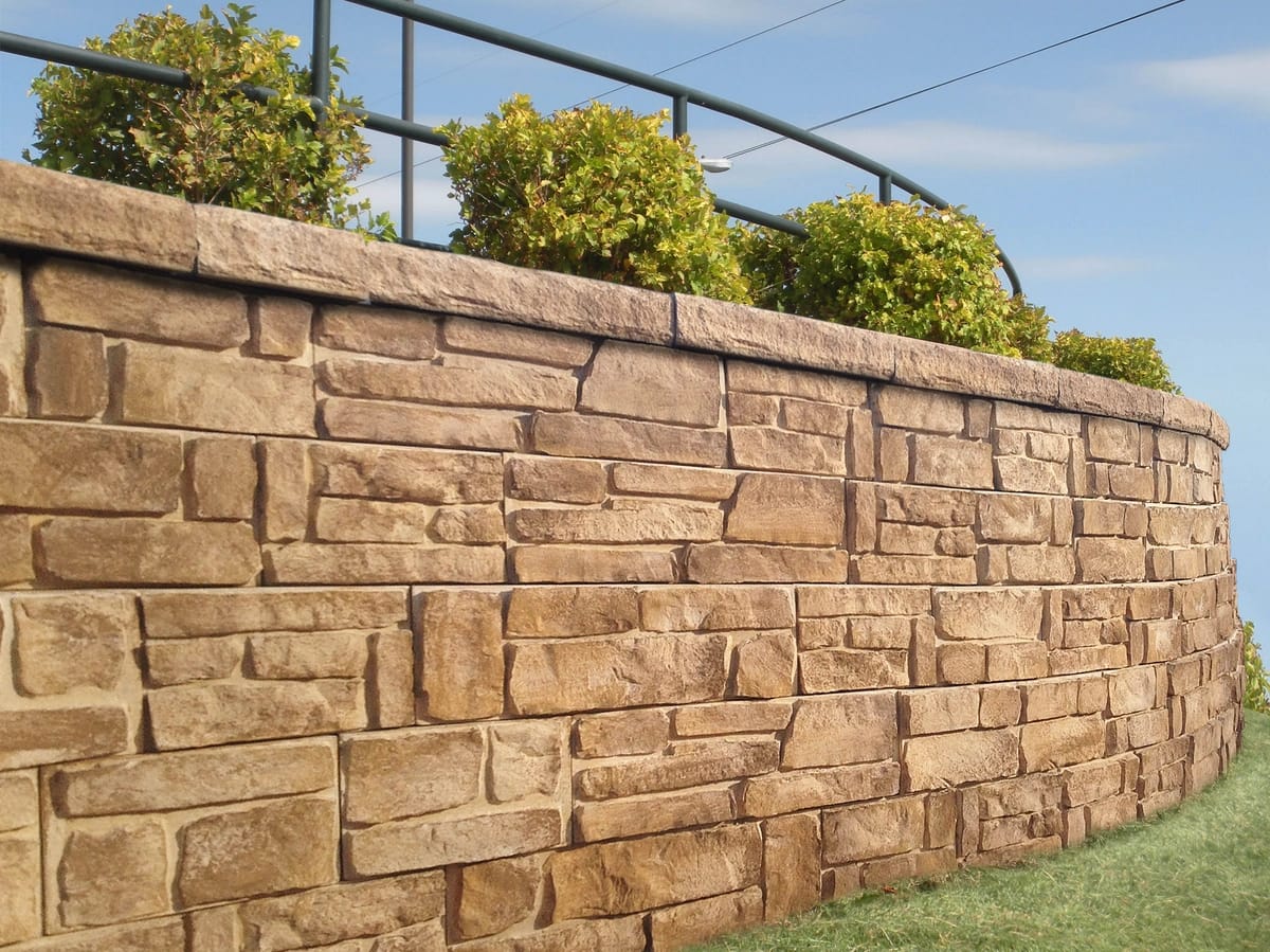 Concrete patio slab with brick house by Trademark Outdoor Services