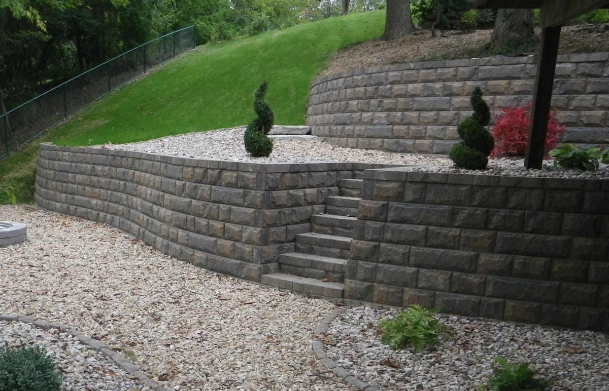 Brick driveway with decorative concrete by Trademark Outdoor Services